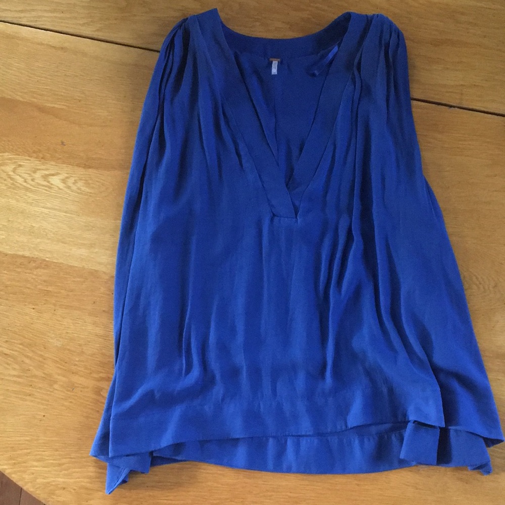 Free people top with high/low hem. Lined.